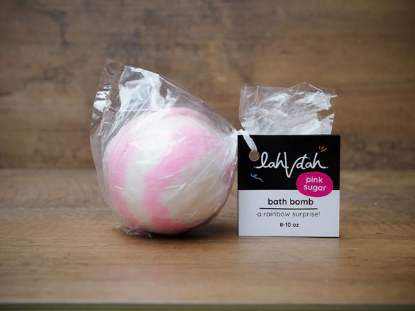 Pink and white LahVdah bath bomb.