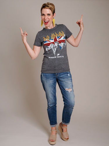 A woman models a gray graphic top.