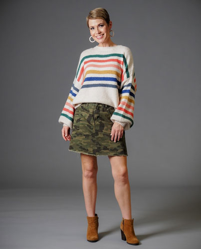  A woman models her cute, striped winter sweater.